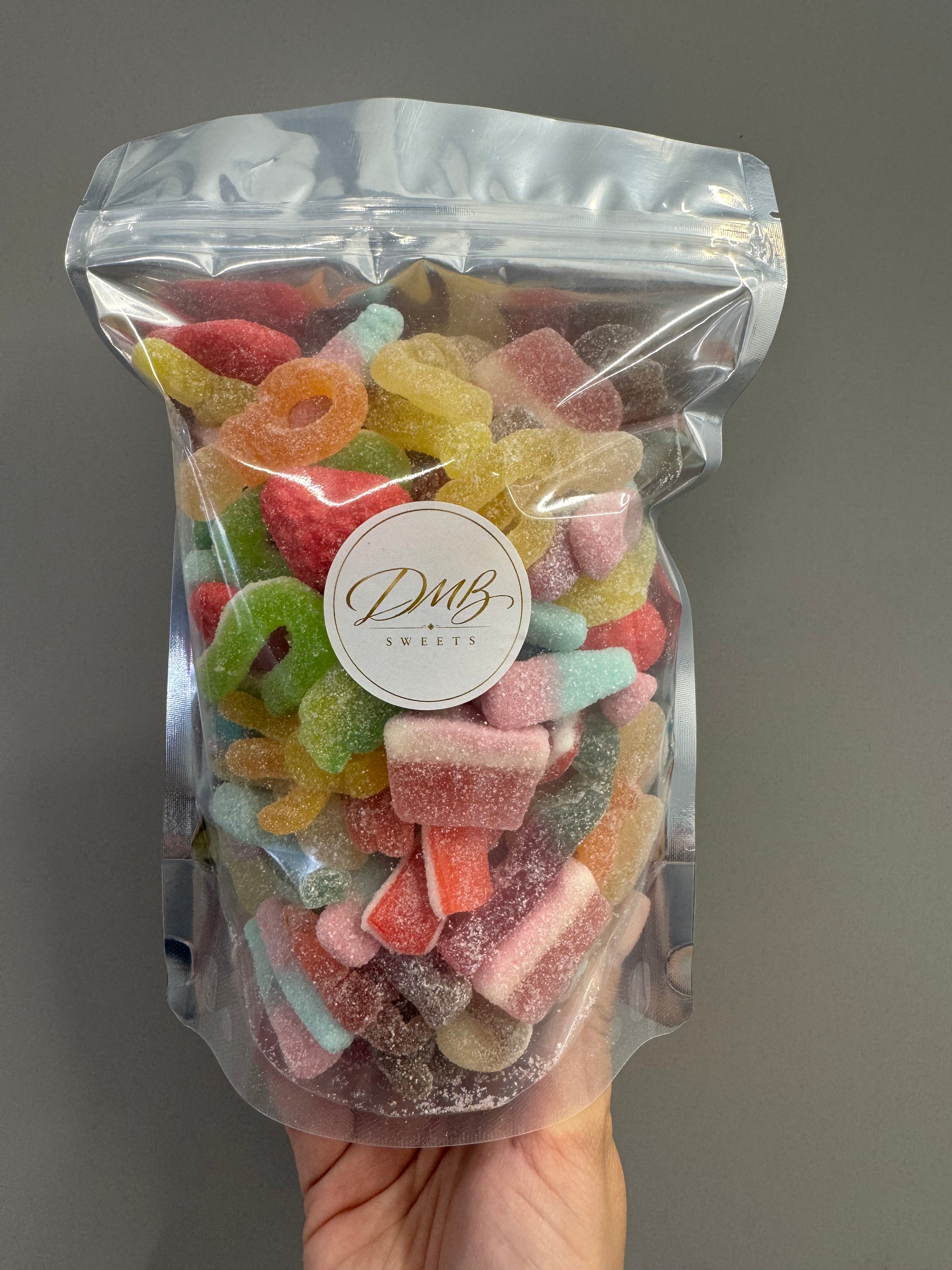 DMB Sweets Pick N Mix Fizzy Bag 500g in a clear resealable bag packed with a colourful assortment of fizzy sweets
