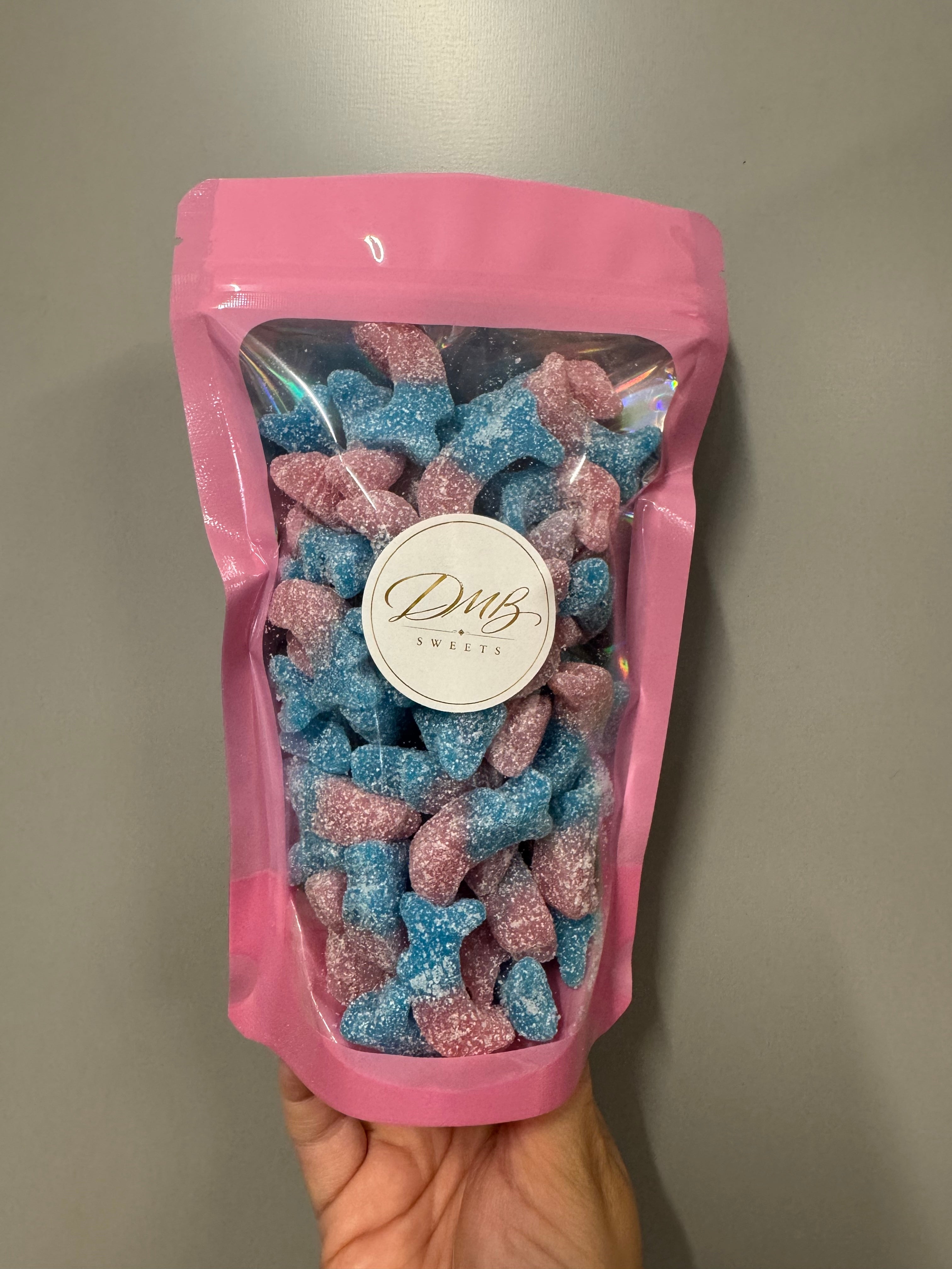 DMB Sweets Fizzy Bubblegum Dolphins in a pink branded bag - illustration purposes only