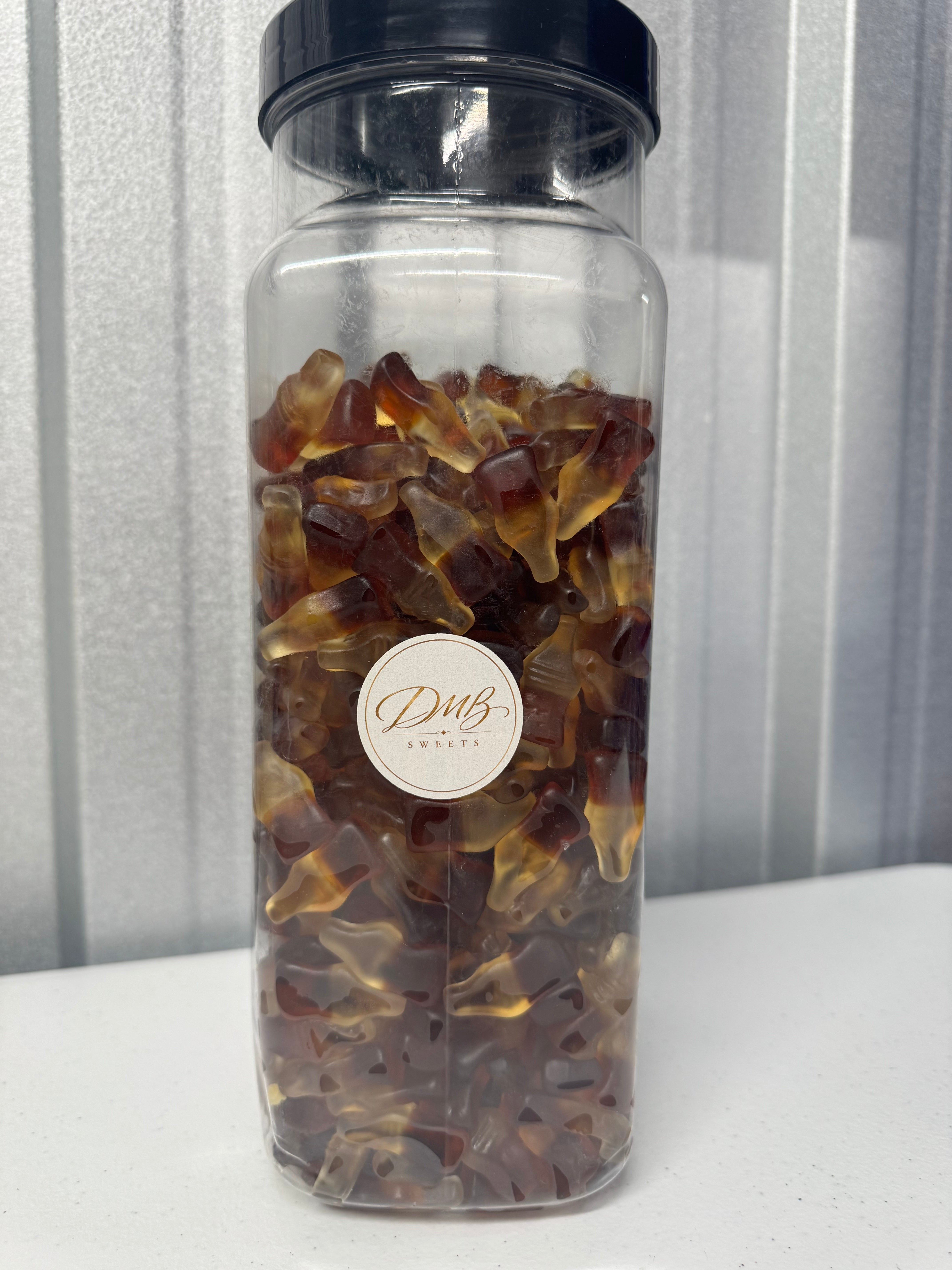 Haribo Cola Bottles gummy sweets in a DMB Sweets jar