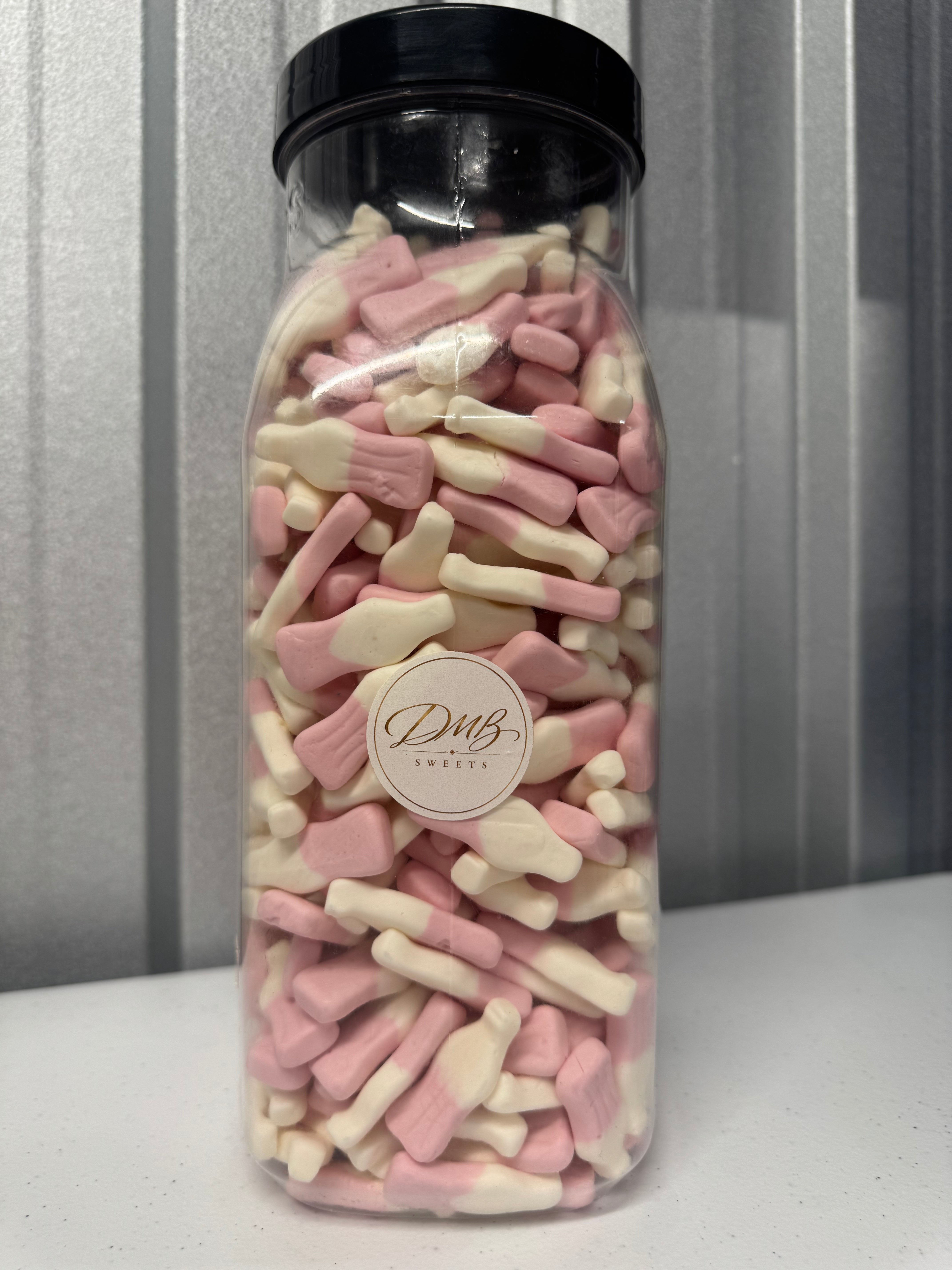 Foam Milkshake Bottles pink and white sweets in a DMB Sweets jar