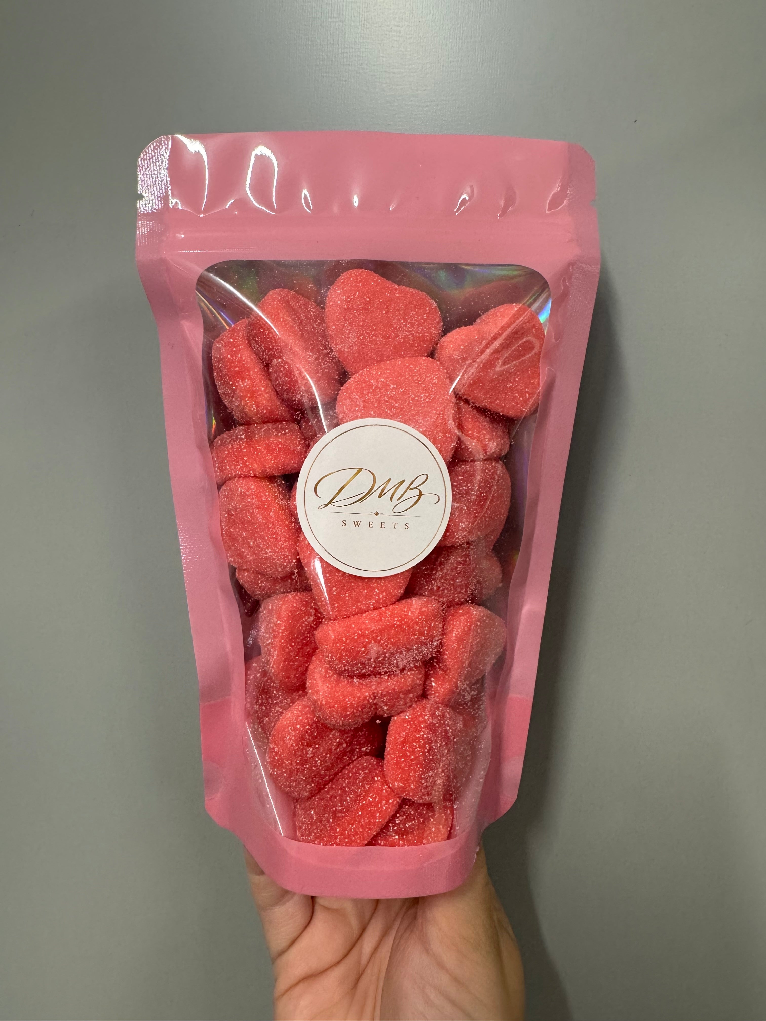 DMB Sweets Jelly Filled Strawberry Hearts 300g in a pink resealable pouch with clear window