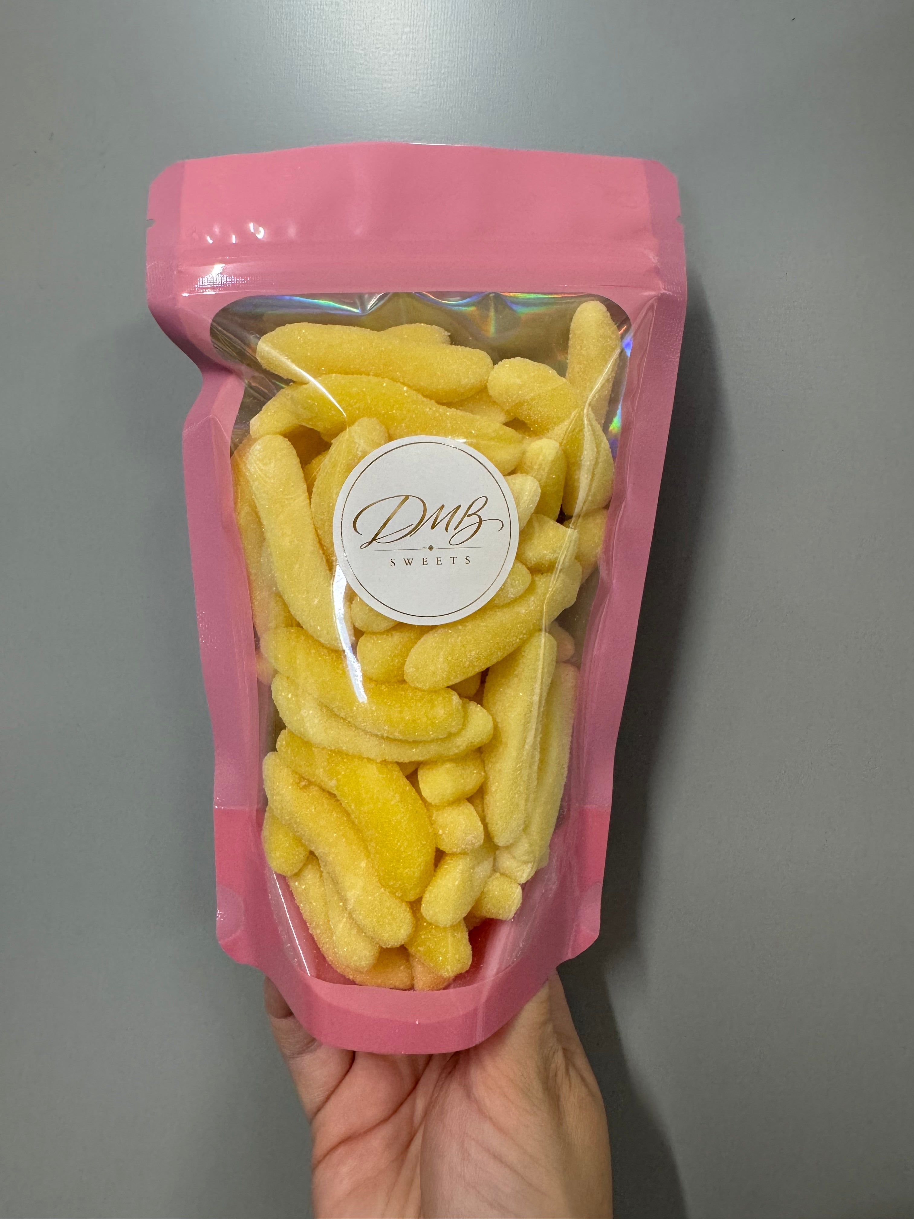 Fizzy Bananas 300g in a DMB Sweets pink pouch
