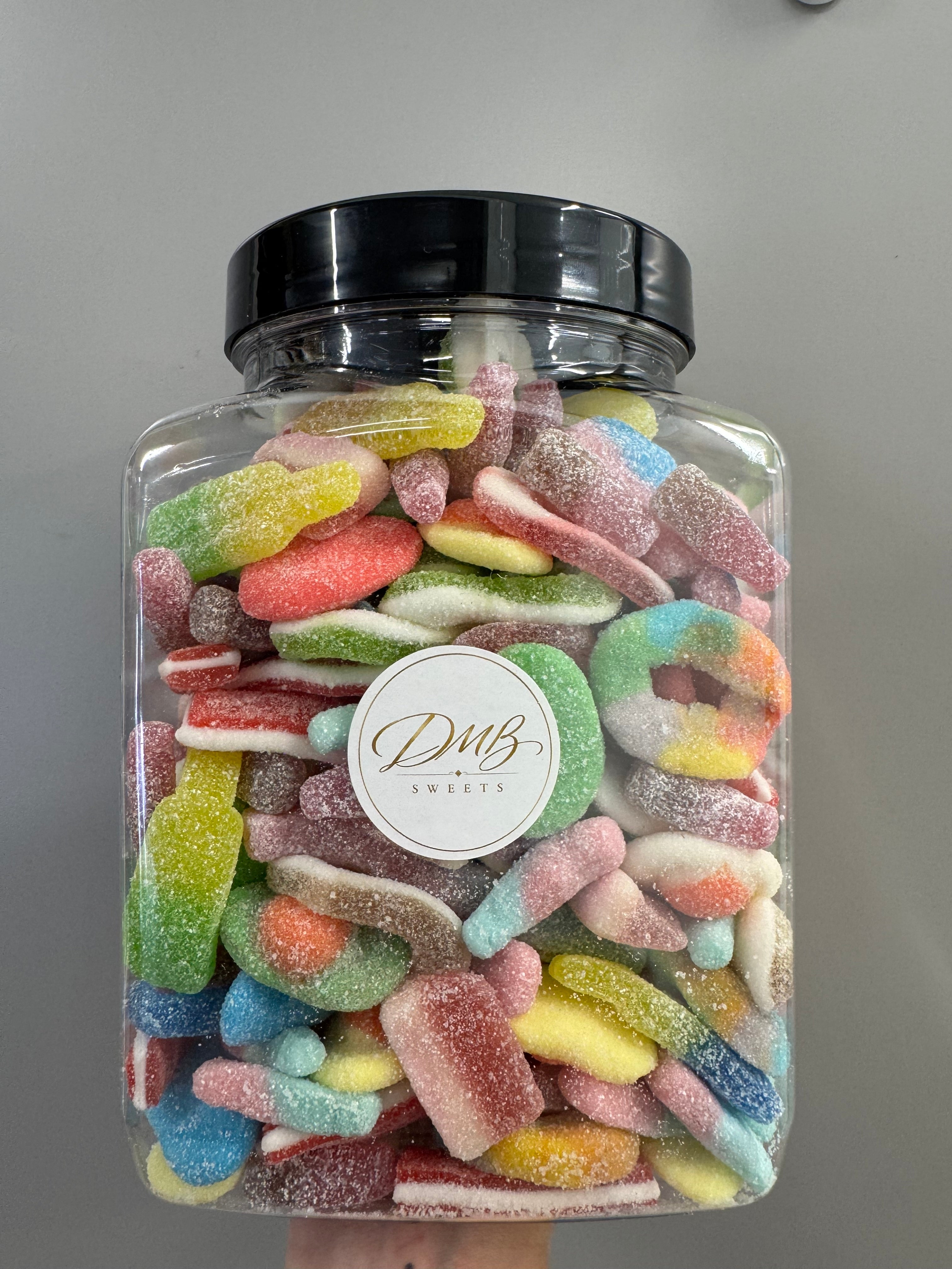 DMB Sweets Fizzy Pick N Mix Jar filled with a colourful assortment of fizzy sugar-dusted sweets with black lid
