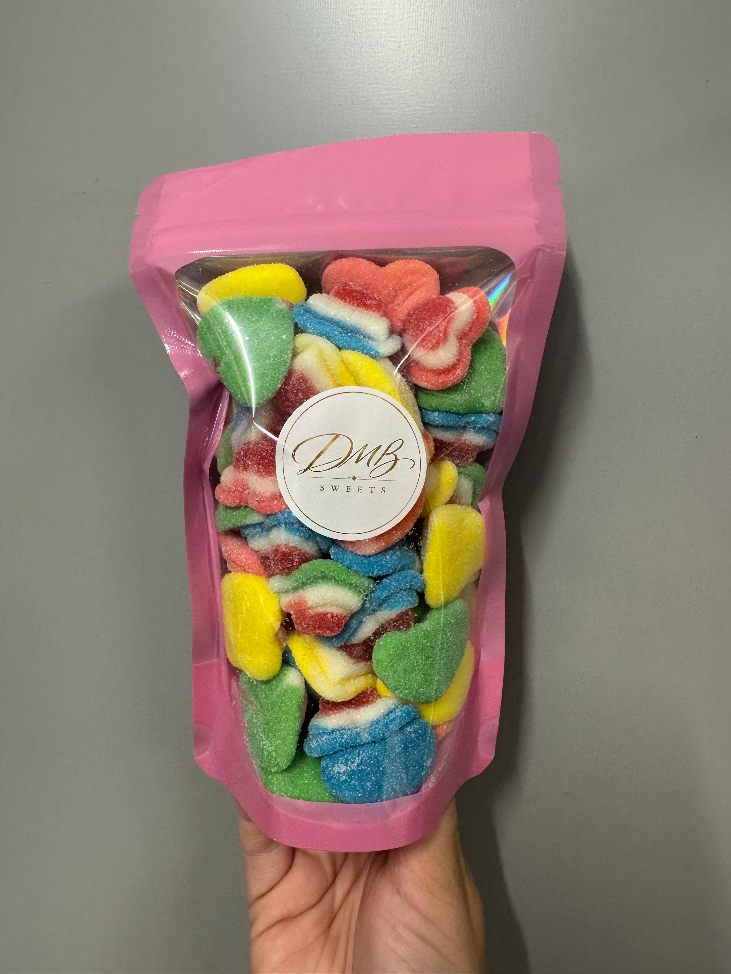 Fizzy Rainbow Hearts in a pink DMB Sweets pouch