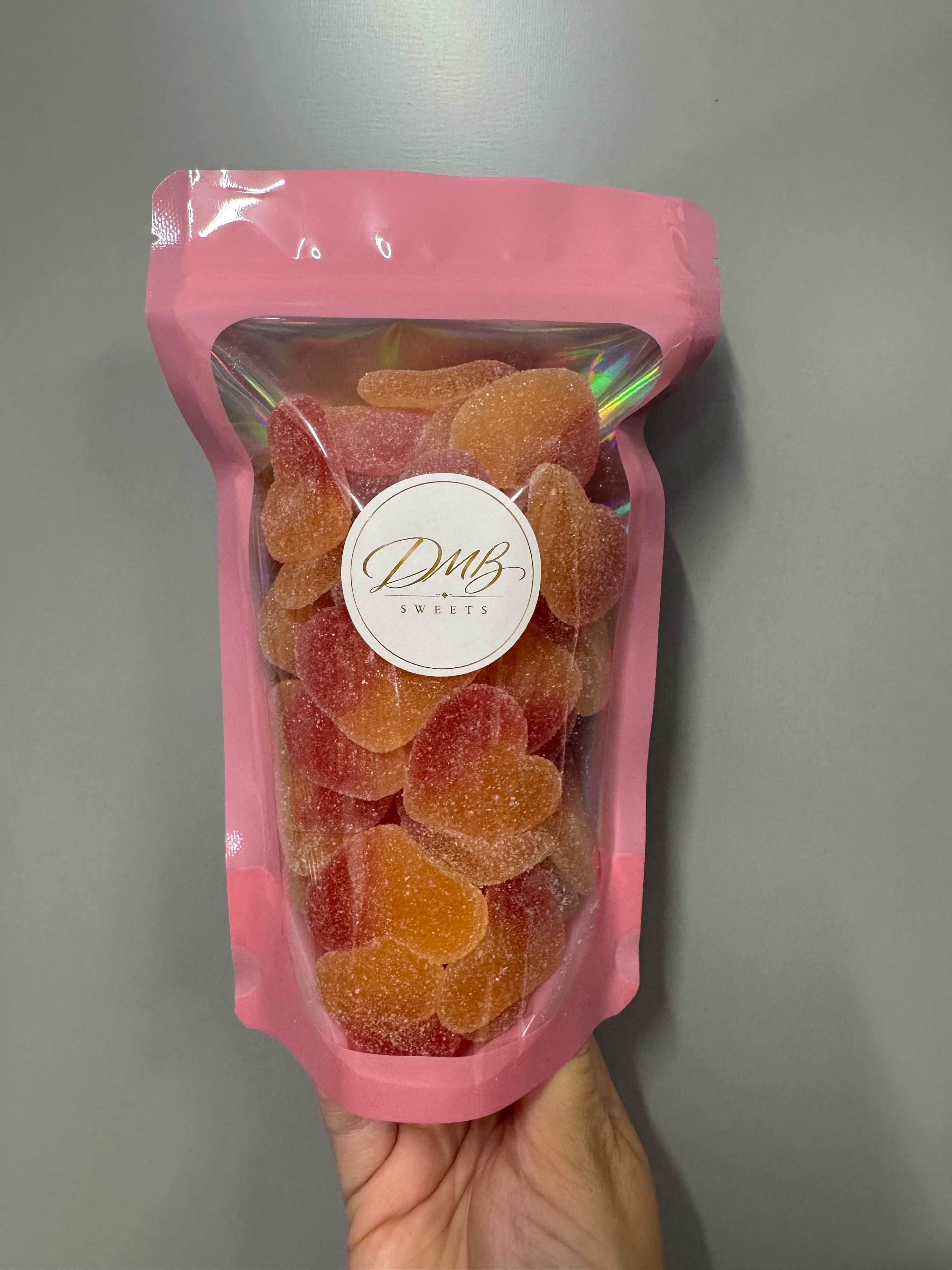 Peach Hearts 300g in a DMB Sweets pink pouch